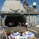 Illustration for article titled Steel Beach- When US Navy Ships Throw Giant Beach Picnic Parties